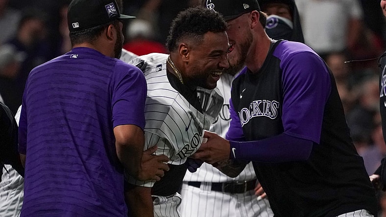 Jul 1, 2021; Denver, Colorado, USA; Colorado Rockies catcher Elias Diaz (35) celebrates a three-run walk-off home run against the St. Louis Cardinals during the ninth inning at Coors Field. Mandatory Credit: Troy Babbitt-USA TODAY Sports