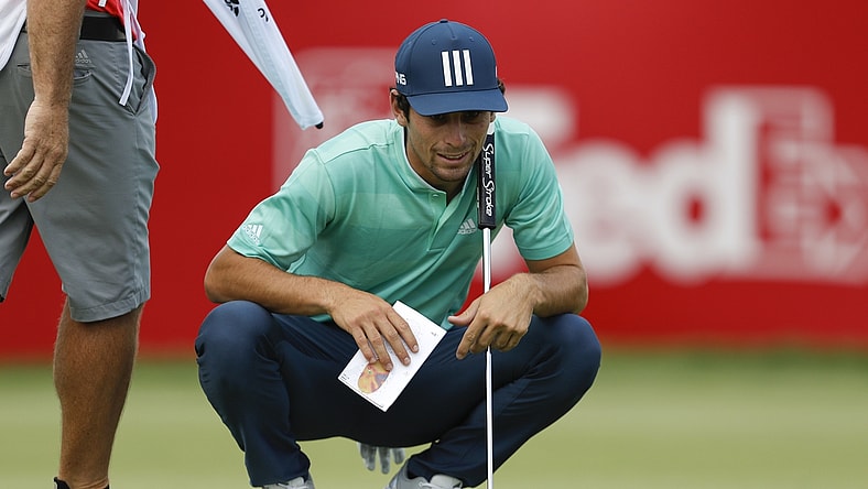 Jul 2, 2021; Detroit, Michigan, USA; Joaquin Niemann reads his putt on the 17th hole during the second round of the Rocket Mortgage Classic golf tournament. Mandatory Credit: Raj Mehta-USA TODAY Sports