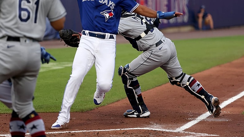 Jul 2, 2021; Buffalo, New York, USA;  Tampa Bay Rays catcher Francisco Mejia (28) misses the tag as Toronto Blue Jays second baseman Marcus Semien (10) is safe at home plate during the second inning at Sahlen Field. Mandatory Credit: Timothy T. Ludwig-USA TODAY Sports