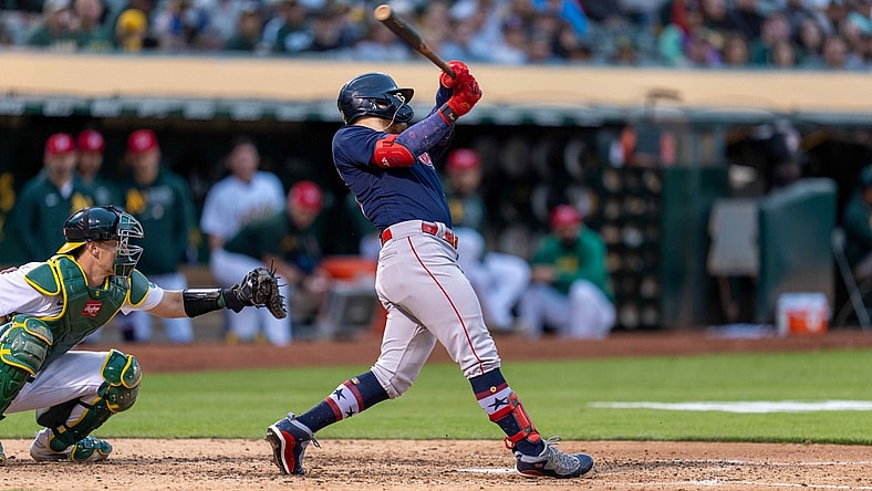 Jul 2, 2021; Oakland, California, USA;  Boston Red Sox left fielder Alex Verdugo (99) hits a RBI single during the fifth inning against the Oakland Athletics at RingCentral Coliseum. Mandatory Credit: Neville E. Guard-USA TODAY Sports