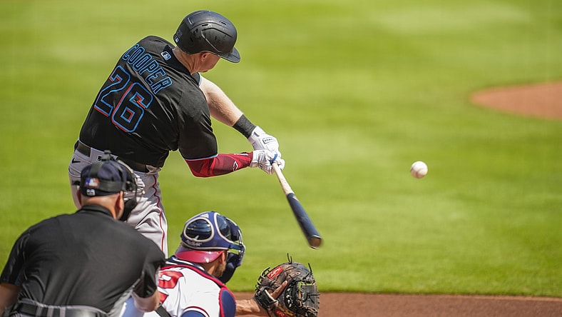 Jul 3, 2021; Cumberland, Georgia, USA; Miami Marlins first baseman Garrett Cooper (26) strikes out against the Atlanta Braves during the first inning at Truist Park. Mandatory Credit: Dale Zanine-USA TODAY Sports