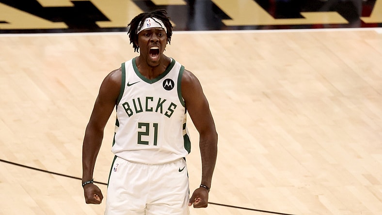 Jul 3, 2021; Atlanta, Georgia, USA; Milwaukee Bucks guard Jrue Holiday (21) reacts after a basket during the first quarter against the Atlanta Hawks in game six of the Eastern Conference Finals for the 2021 NBA Playoffs at State Farm Arena. Mandatory Credit: Jason Getz-USA TODAY Sports