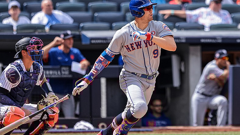 Jul 4, 2021; Bronx, New York, USA; New York Mets center fielder Brandon Nimmo (9) hits an RBI single during the fourth inning against the New York Yankees at Yankee Stadium. Mandatory Credit: Vincent Carchietta-USA TODAY Sports