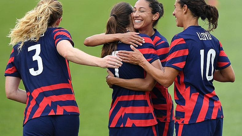 Jul 5, 2021; East Hartford, Connecticut, USA;  United States forward Tobin Heath (7) and United States forward Carli Lloyd (10) and United States midfielder Sam Mewis (3) celebrate the goal by the United States forward Christen Press (11) against the Mexico during the first half during a USWNT Send-off Series soccer match at Pratt & Whitney Stadium. Mandatory Credit: Dennis Schneidler-USA TODAY Sports