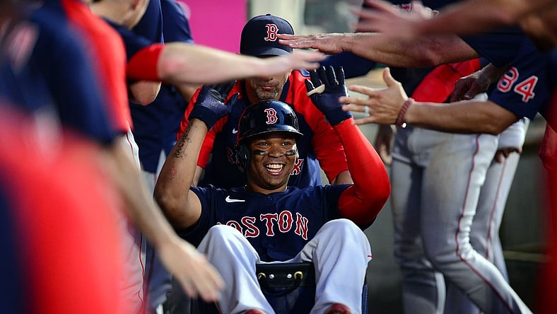 Jul 5, 2021; Anaheim, California, USA; Boston Red Sox third baseman Rafael Devers (11) celebrates his two run home run hit against the Los Angeles Angels during the fourth inning at Angel Stadium. Mandatory Credit: Gary A. Vasquez-USA TODAY Sports