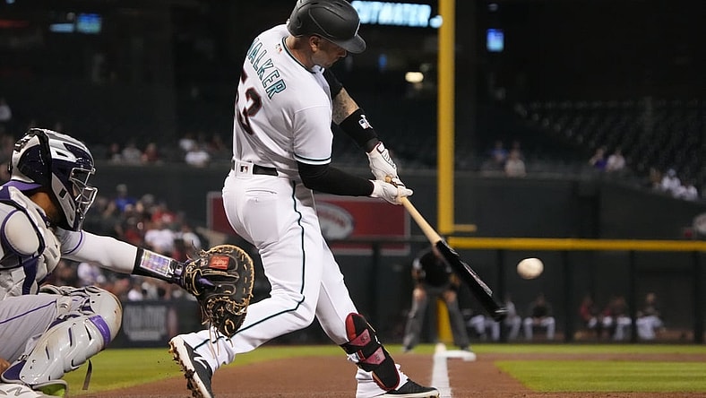 Jul 6, 2021; Phoenix, Arizona, USA; Arizona Diamondbacks first baseman Christian Walker (53) hits an RBI double against the Colorado Rockies in the first inning at Chase Field. Mandatory Credit: Rick Scuteri-USA TODAY Sports