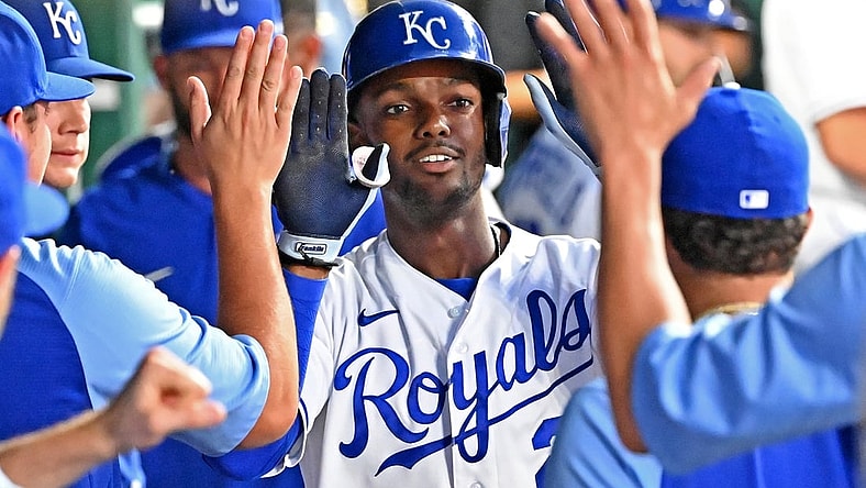 Jul 6, 2021; Kansas City, Missouri, USA;  Kansas City Royals center fielder Michael A. Taylor (2) celebrates in the dugout after hitting a solo home run during the fifth inning against the Cincinnati Reds at Kauffman Stadium. Mandatory Credit: Peter Aiken-USA TODAY Sports