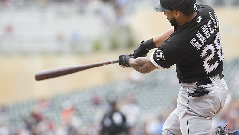 Jul 7, 2021; Minneapolis, Minnesota, USA; Chicago White Sox second baseman Leury Garcia (28) hits a two-run home run during the second inning against the Minnesota Twins at Target Field. Mandatory Credit: Marilyn Indahl-USA TODAY Sports
