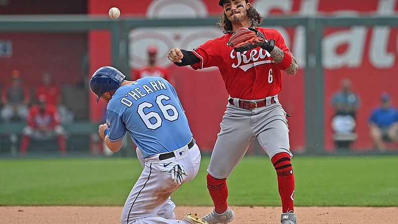 Jul 7, 2021; Kansas City, Missouri, USA; Cincinnati Reds second baseman Jonathan India (6) has his throw to first base hit off Kansas City Royals base runner Ryan O'Hearn's (66) helmet during the fourth inning at Kauffman Stadium. Mandatory Credit: Peter Aiken-USA TODAY Sports