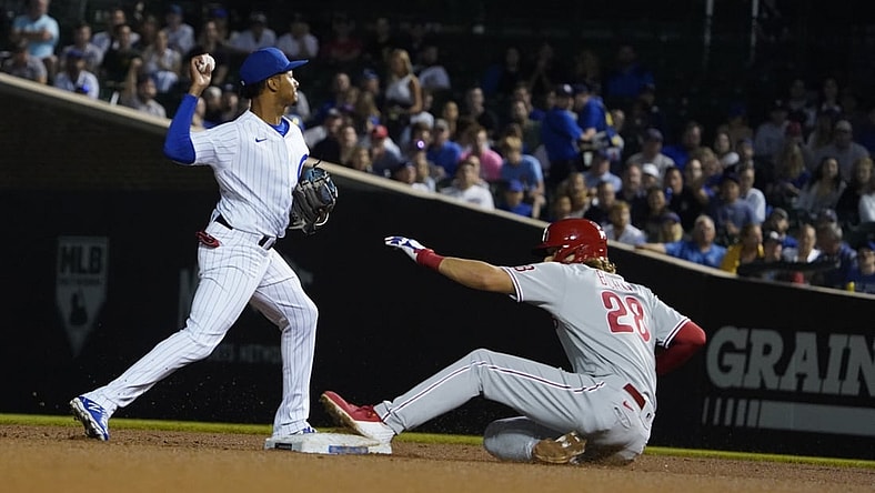 Jul 7, 2021; Chicago, Illinois, USA; Chicago Cubs shortstop Sergio Alcantara (51) forces out Philadelphia Phillies third baseman Alec Bohm (28) at second base during the fifth inning at Wrigley Field. Mandatory Credit: David Banks-USA TODAY Sports