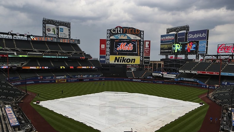 Jul 8, 2021; New York City, New York, USA; A tarp covers the infield prior to the game between the Pittsburgh Pirates and the New York Mets being postponed at Citi Field. Mandatory Credit: Wendell Cruz-USA TODAY Sports