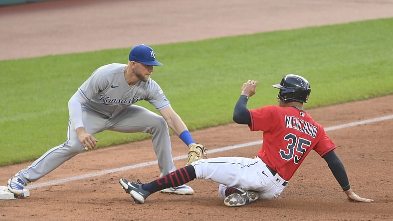 Jul 8, 2021; Cleveland, Ohio, USA; Kansas City Royals third baseman Hunter Dozier (17) tags Cleveland Indians left fielder Oscar Mercado (35) to complete a double play in the third inning at Progressive Field. Mandatory Credit: David Richard-USA TODAY Sports