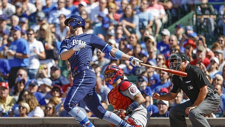 Jul 9, 2021; Chicago, Illinois, USA; Chicago Cubs third baseman Kris Bryant (17) hits a three-run double against the St. Louis Cardinals during the seventh inning at Wrigley Field. Mandatory Credit: Kamil Krzaczynski-USA TODAY Sports
