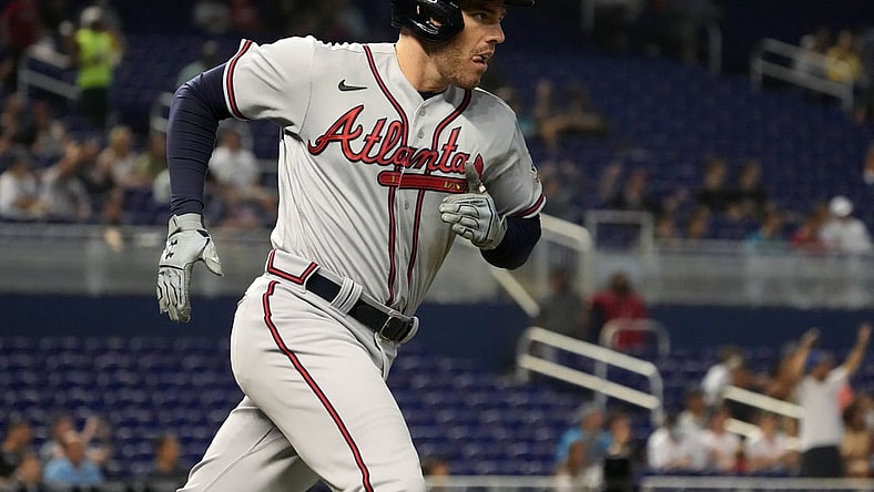 Jul 9, 2021; Miami, Florida, USA; Atlanta Braves first baseman Freddie Freeman (5) rounds the bases after hitting a solo homerun in the 1st inning against the Miami Marlins at loanDepot park. Mandatory Credit: Jasen Vinlove-USA TODAY Sports