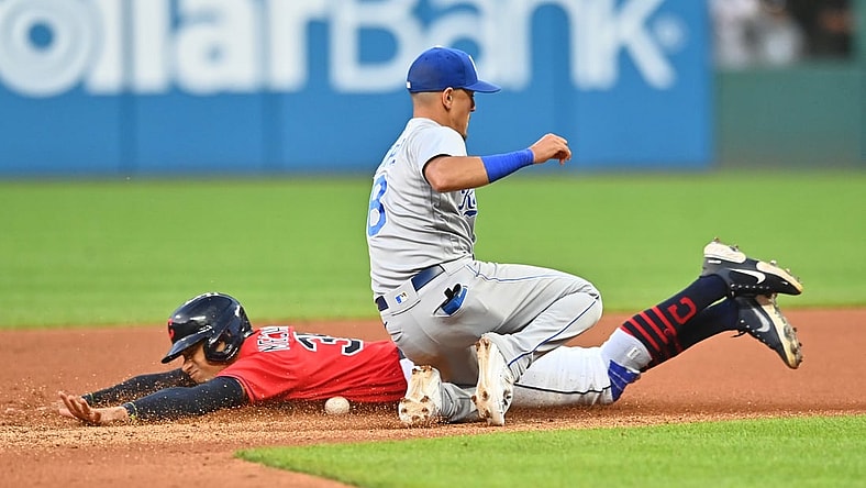 Jul 9, 2021; Cleveland, Ohio, USA; Cleveland Indians left fielder Oscar Mercado (35) slides into second base on a stolen base as Kansas City Royals shortstop Nicky Lopez (8) can not handle the throw during the seventh inning at Progressive Field. Mandatory Credit: Ken Blaze-USA TODAY Sports