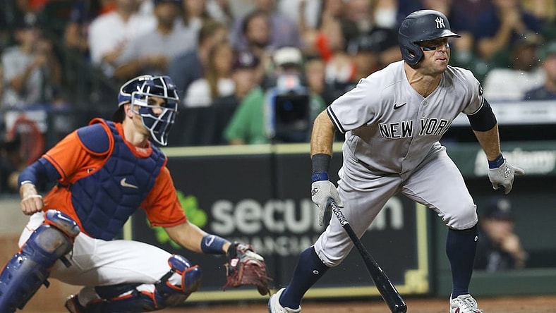 Jul 9, 2021; Houston, Texas, USA; New York Yankees center fielder Brett Gardner (11) hits a two run RBI against the Houston Astros in the fourth inning at Minute Maid Park. Mandatory Credit: Thomas Shea-USA TODAY Sports
