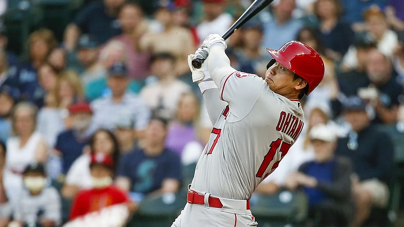 Jul 9, 2021; Seattle, Washington, USA; Los Angeles Angels designated hitter Shohei Ohtani (17) hits a solo home run against the Seattle Mariners during the third inning at T-Mobile Park. Mandatory Credit: Joe Nicholson-USA TODAY Sports