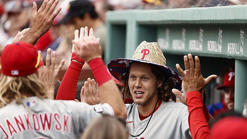 Jul 10, 2021; Boston, Massachusetts, USA; Philadelphia Phillies third baseman Alec Bohm (28) is congratulated by teammates in the dugout after his two run home run against the Boston Red Sox during the second inning at Fenway Park. Mandatory Credit: Winslow Townson-USA TODAY Sports