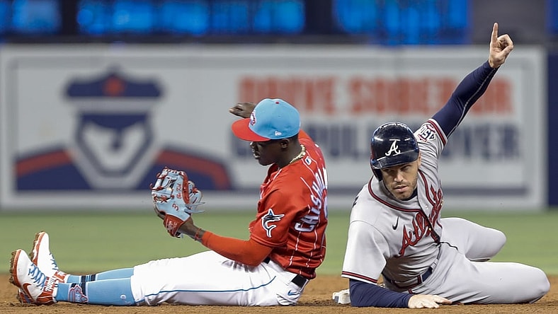 Jul 10, 2021; Miami, Florida, USA; Atlanta Braves first baseman Freddie Freeman (5) reacts from second base during the third inning against Miami Marlins second baseman Jazz Chisholm Jr. (2) at loanDepot Park. Mandatory Credit: Sam Navarro-USA TODAY Sports