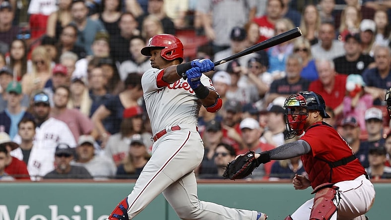 Jul 10, 2021; Boston, Massachusetts, USA; Philadelphia Phillies shortstop Jean Segura (2) hits a two run single against the Boston Red Sox during the eighth inning at Fenway Park. Mandatory Credit: Winslow Townson-USA TODAY Sports