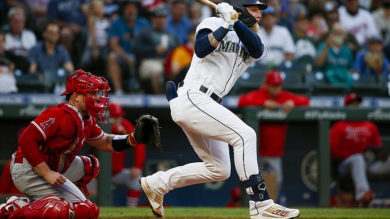 Jul 10, 2021; Seattle, Washington, USA; Seattle Mariners center fielder Jake Fraley (28) hits into a fielders choice to drive in a run against the Los Angeles Angels during the fourth inning at T-Mobile Park. Mandatory Credit: Joe Nicholson-USA TODAY Sports