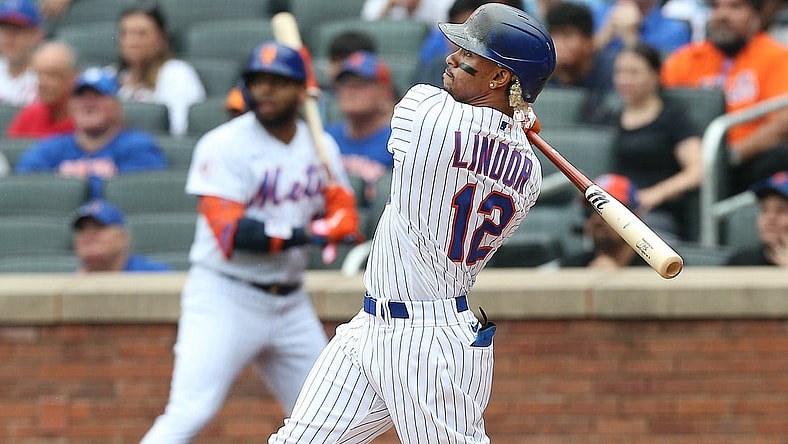Jul 11, 2021; New York City, New York, USA; New York Mets shortstop Francisco Lindor (12) hits a two-run home run against the Pittsburgh Pirates during the first inning at Citi Field. Mandatory Credit: Andy Marlin-USA TODAY Sports