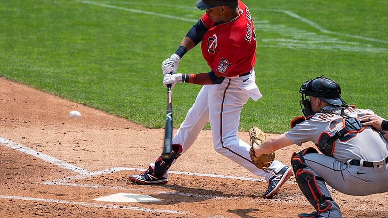 Jul 11, 2021; Minneapolis, Minnesota, USA; Minnesota Twins second baseman Jorge Polanco (11) hits a single during the second inning against the Detroit Tigers at Target Field. Mandatory Credit: Jordan Johnson-USA TODAY Sports