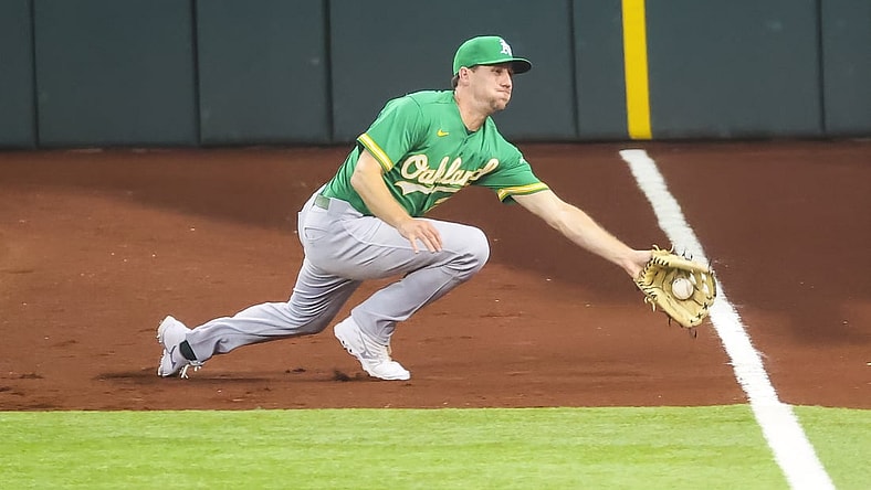 Jul 11, 2021; Arlington, Texas, USA; Oakland Athletics right fielder Stephen Piscotty (25) makes a diving catch during the sixth inning against the Texas Rangers at Globe Life Field. Mandatory Credit: Kevin Jairaj-USA TODAY Sports