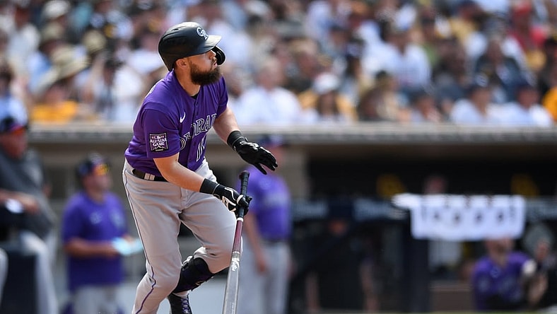 Jul 11, 2021; San Diego, California, USA; Colorado Rockies pinch hitter Chris Owings (12) watches his home run against the San Diego Padres during the seventh inning at Petco Park. Mandatory Credit: Orlando Ramirez-USA TODAY Sports