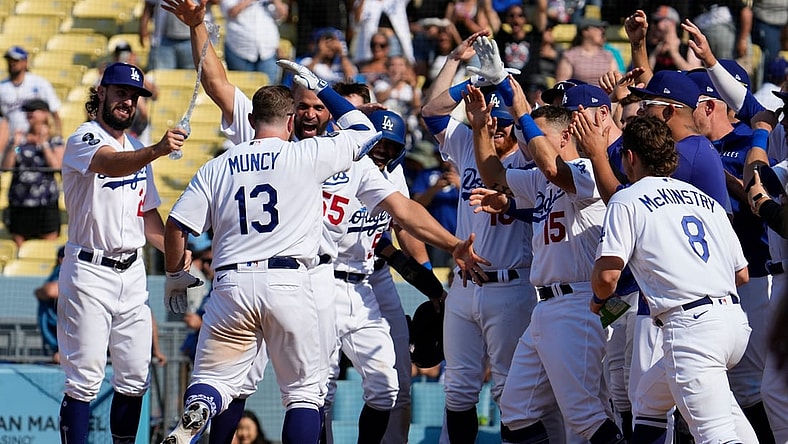 Jul 11, 2021; Los Angeles, California, USA; Los Angeles Dodgers second baseman Max Muncy (13) heads to home plate after hitting a 3-run home run in the bottom of the ninth clear the fence to beat the Arizona Diamondbacks 7-4 at Dodger Stadium. Mandatory Credit: Robert Hanashiro-USA TODAY Sports