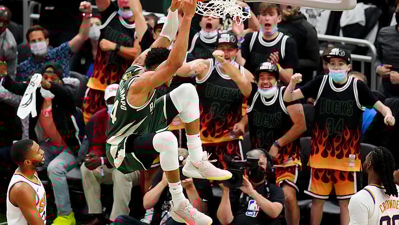 Jul 11, 2021; Milwaukee, Wisconsin, USA; Milwaukee Bucks forward Giannis Antetokounmpo (34) dunks against the Phoenix Suns during game three of the 2021 NBA Finals at Fiserv Forum. Mandatory Credit: Mark J. Rebilas-USA TODAY Sports