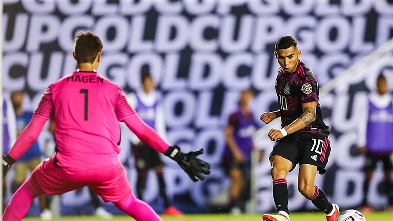 Jul 14, 2021; Dallas, Texas, USA; Mexico midfielder Orbel    n Pineda (10) assists a goal by Mexico forward Rogelio Funes Mori (not pictured) against Guatemala goalkeeper Nicholas Hagen (1) during the second half of CONCACAF Gold Cup Soccer group stage play at Cotton Bowl. Mandatory Credit: Ben Ludeman-USA TODAY Sports