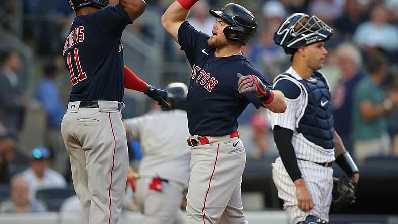 Jul 16, 2021; Bronx, New York, USA; Boston Red Sox second baseman Christian Arroyo (39) celebrates his two run home run against the New York Yankees with third baseman Rafael Devers (11) during the second inning at Yankee Stadium. Mandatory Credit: Brad Penner-USA TODAY Sports