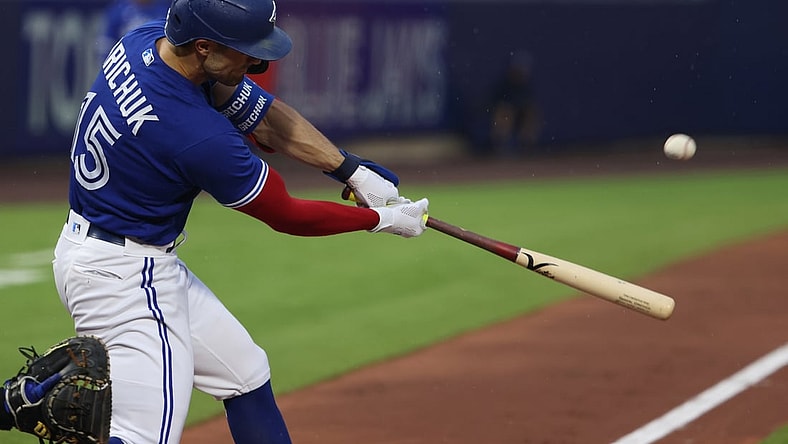 Jul 16, 2021; Buffalo, New York, USA;  Toronto Blue Jays right fielder Randal Grichuk (15) hits a home run during the third inning against the Texas Rangers at Sahlen Field. Mandatory Credit: Timothy T. Ludwig-USA TODAY Sports