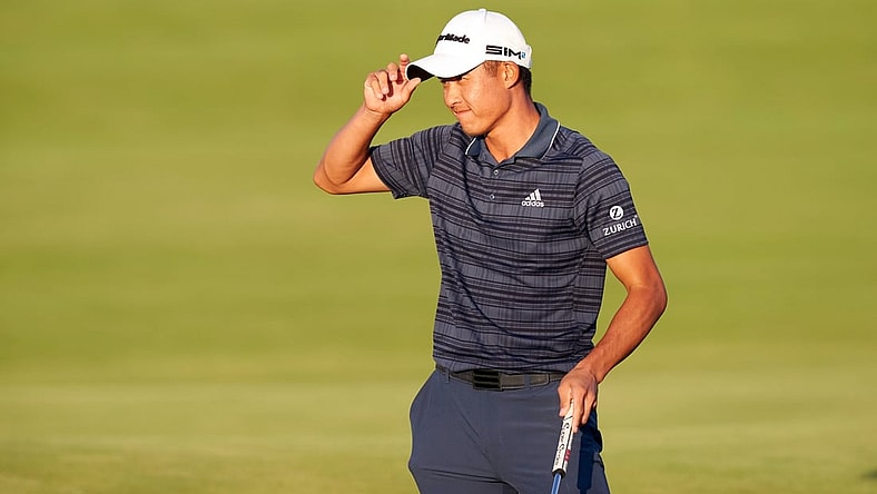 Jul 17, 2021; Sandwich, England, GBR; Collin Morikawa tips his hat after putting out on the 18th green during the third round of the Open Championship golf tournament. Mandatory Credit: Peter van den Berg-USA TODAY Sports