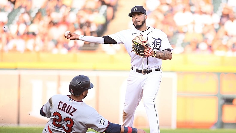 Jul 17, 2021; Detroit, Michigan, USA; Detroit Tigers second baseman Harold Castro (right) forces Minnesota Twins designated hitter Nelson Cruz (23) out at second base and throws to first base during the fifth inning at Comerica Park. Mandatory Credit: Tim Fuller-USA TODAY Sports