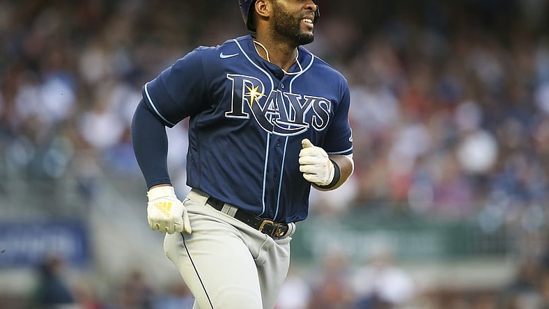 Jul 17, 2021; Atlanta, Georgia, USA; Tampa Bay Rays third baseman Yandy Diaz (2) hits a single against the Atlanta Braves in the fourth inning at Truist Park. Mandatory Credit: Brett Davis-USA TODAY Sports