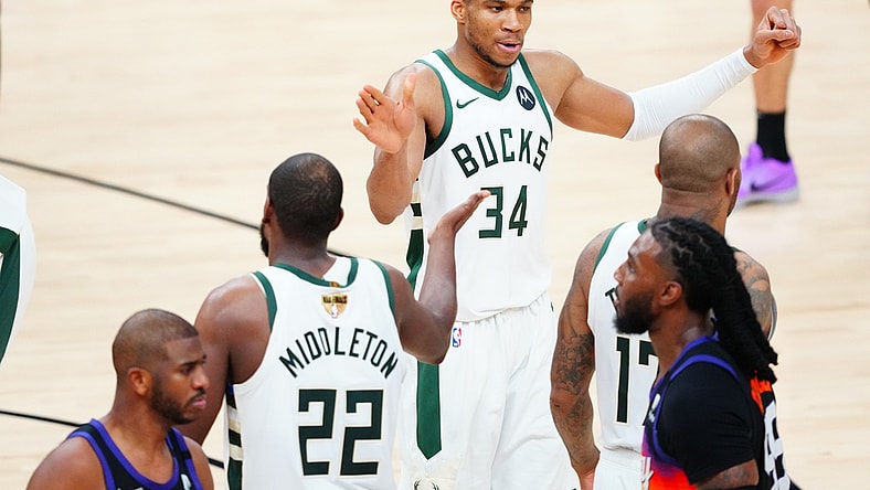 Jul 17, 2021; Phoenix, Arizona, USA; Milwaukee Bucks forward Giannis Antetokounmpo (34) celebrates with Milwaukee Bucks forward Khris Middleton (22) in the second half against the Phoenix Suns during game five of the 2021 NBA Finals at Phoenix Suns Arena. Mandatory Credit: Mark J. Rebilas-USA TODAY Sports
