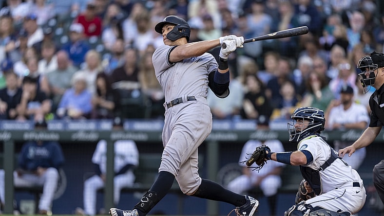 Jul 7, 2021; Seattle, Washington, USA; New York Yankees outfielder Aaron Judge (99) hits a home run during a game against the Seattle Mariners at T-Mobile Park. The Yankees won 5-4. Mandatory Credit: Stephen Brashear-USA TODAY Sports