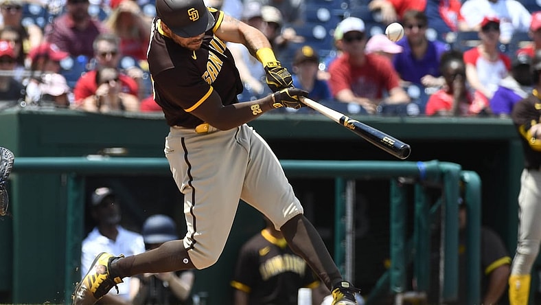 Jul 18, 2021; Washington, District of Columbia, USA; San Diego Padres left fielder Tommy Pham (28) hits an RBI single against the Washington Nationals in the 7th inning after resuming play from last night's suspended game at Nationals Park. Mandatory Credit: Brad Mills-USA TODAY Sports