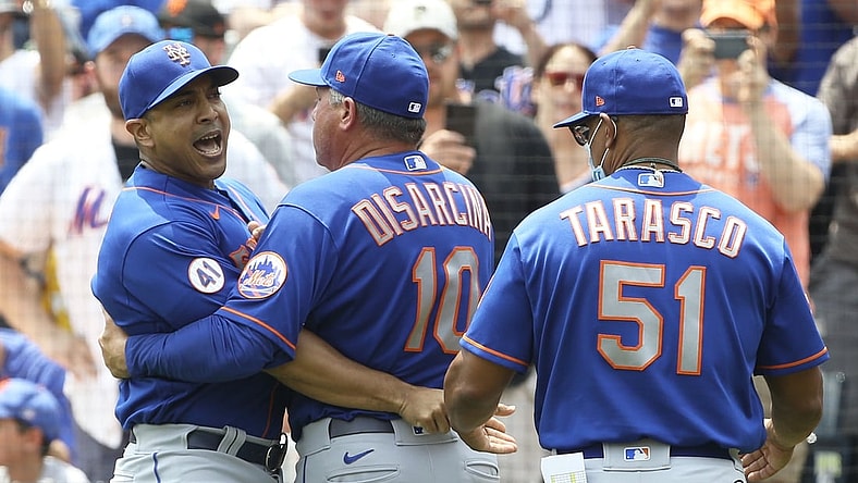 Jul 18, 2021; Pittsburgh, Pennsylvania, USA;  New York Mets manager Luis Rojas (left) reacts while being restrained by third base coach Gary Disarcina (10) and first base coach Tony Tarasco (51) after Rojas was ejected from the game against the Pittsburgh Pirates during the first inning at PNC Park. Mandatory Credit: Charles LeClaire-USA TODAY Sports