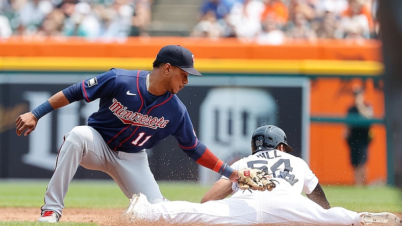 Jul 18, 2021; Detroit, Michigan, USA;  Detroit Tigers center fielder Derek Hill (54) steals second ahead of the tag by Minnesota Twins shortstop Jorge Polanco (11) in the second inning  at Comerica Park. Mandatory Credit: Rick Osentoski-USA TODAY Sports