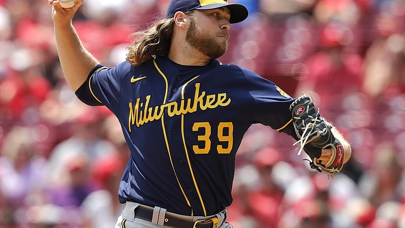 Jul 18, 2021; Cincinnati, Ohio, USA; Milwaukee Brewers starting pitcher Corbin Burnes (39) throws a pitch against the Cincinnati Reds during the first inning at Great American Ball Park. Mandatory Credit: David Kohl-USA TODAY Sports