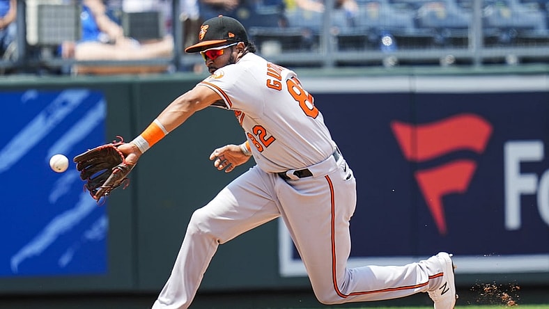 Jul 18, 2021; Kansas City, Missouri, USA; Baltimore Orioles third baseman Kelvin Gutierrez (82) fields a ground ball against the Kansas City Royals during the third inning at Kauffman Stadium. Mandatory Credit: Jay Biggerstaff-USA TODAY Sports