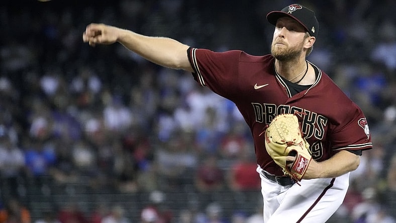 Jul 18, 2021; Phoenix, Arizona, USA; Arizona Diamondbacks starting pitcher Merrill Kelly (29) throws a pitch against the Chicago Cubs in the first inning at Chase Field. Mandatory Credit: Rick Scuteri-USA TODAY Sports
