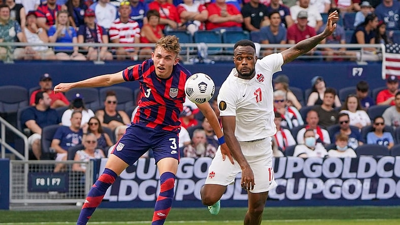 Jul 18, 2021; Kansas City, Kansas, USA; United States defender Sam Vines (3) and Canada forward Cyle Larin (17) battle for the ball during the CONCACAF Gold Cup Soccer group stage play at Children's Mercy Park. Mandatory Credit: Denny Medley-USA TODAY Sports