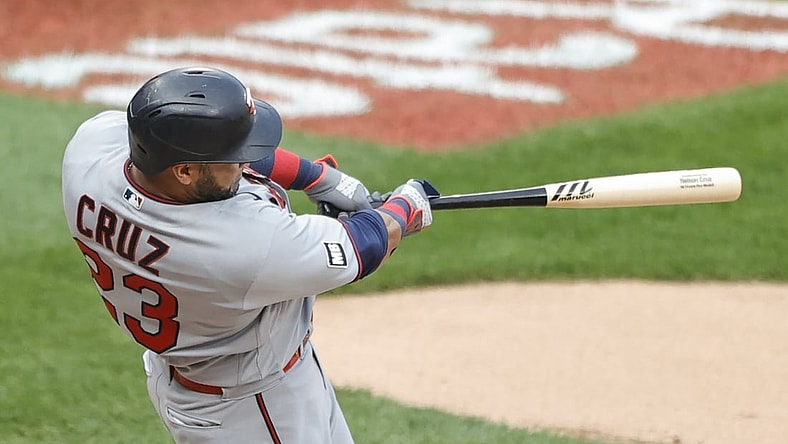 Jul 19, 2021; Chicago, Illinois, USA; Minnesota Twins designated hitter Nelson Cruz (23) hits a solo home run against the Chicago White Sox during the sixth inning of a Game 1 of the doubleheader at Guaranteed Rate Field. Mandatory Credit: Kamil Krzaczynski-USA TODAY Sports