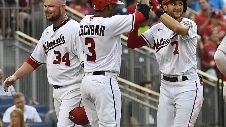 Jul 19, 2021; Washington, District of Columbia, USA; Washington Nationals shortstop Trea Turner (7) is congratulated by second baseman Alcides Escobar (3) after hitting a three run home run against the Miami Marlins during the second inning at Nationals Park. Mandatory Credit: Brad Mills-USA TODAY Sports