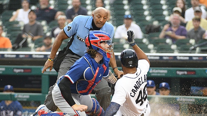 Jul 19, 2021; Detroit, Michigan, USA; Texas Rangers catcher Jonah Heim (28) tags out Detroit Tigers designated hitter Jeimer Candelario (46) at home during the fourth inning at Comerica Park. Mandatory Credit: Tim Fuller-USA TODAY Sports