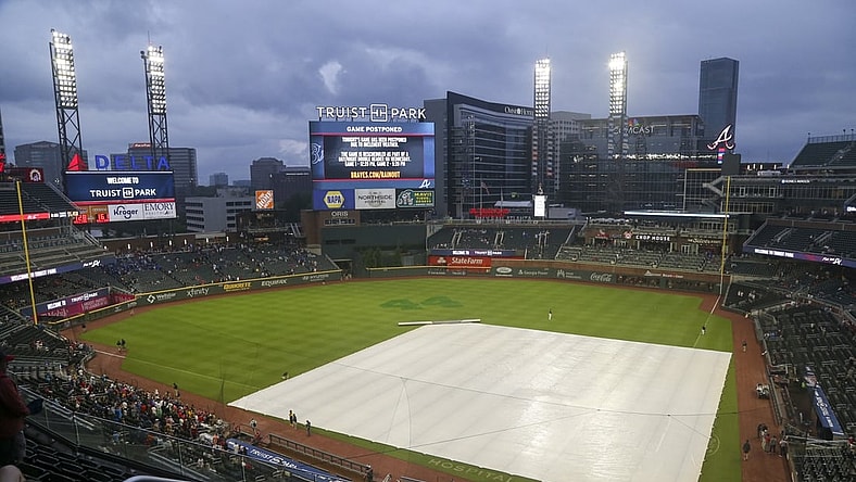 Jul 19, 2021; Atlanta, Georgia, USA; General view of the tarp on the field at Truist Park after a game was canceled between the Atlanta Braves and San Diego Padres due to rain. Mandatory Credit: Brett Davis-USA TODAY Sports